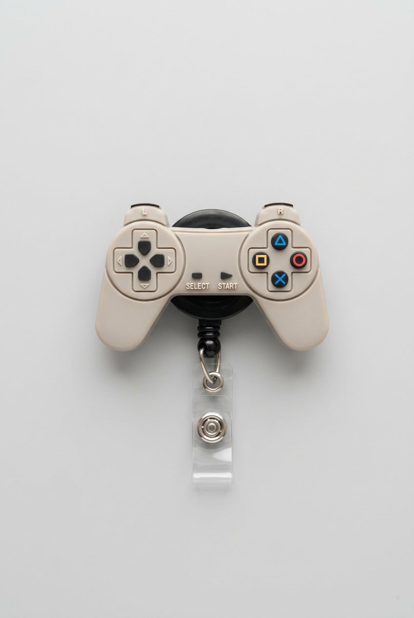 Gaming controller keychain on a wooden surface